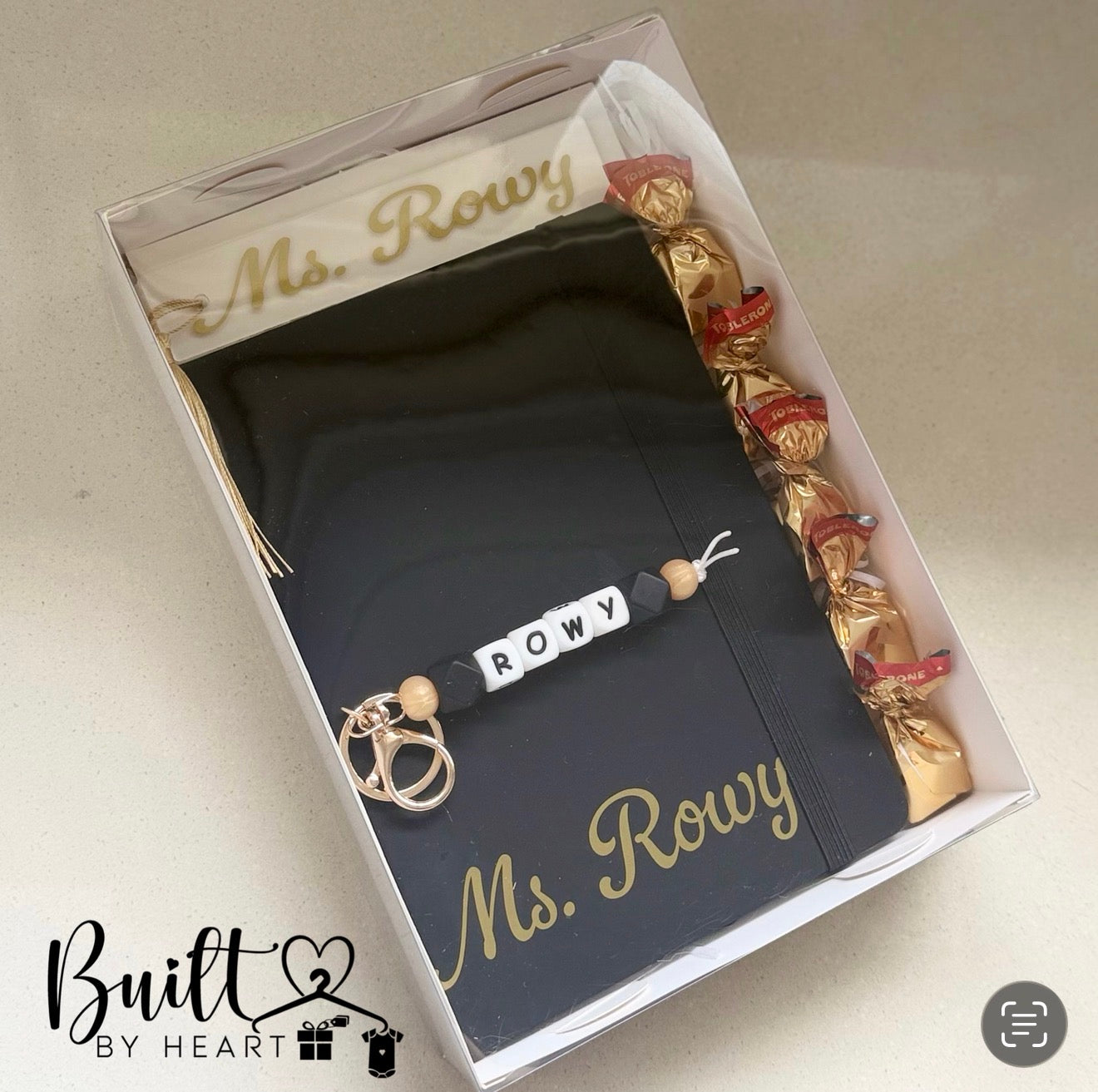 Personalised black teacher gift set with custom notebook, beaded name keychain and gold-wrapped chocolates