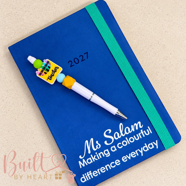 Personalised blue 2027 teacher diary with matching colourful teacher-themed pen